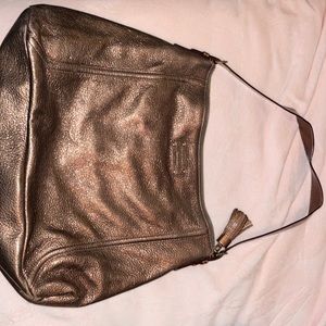 Kate Spade metallic bronze leather bag with black and white polka dot interior